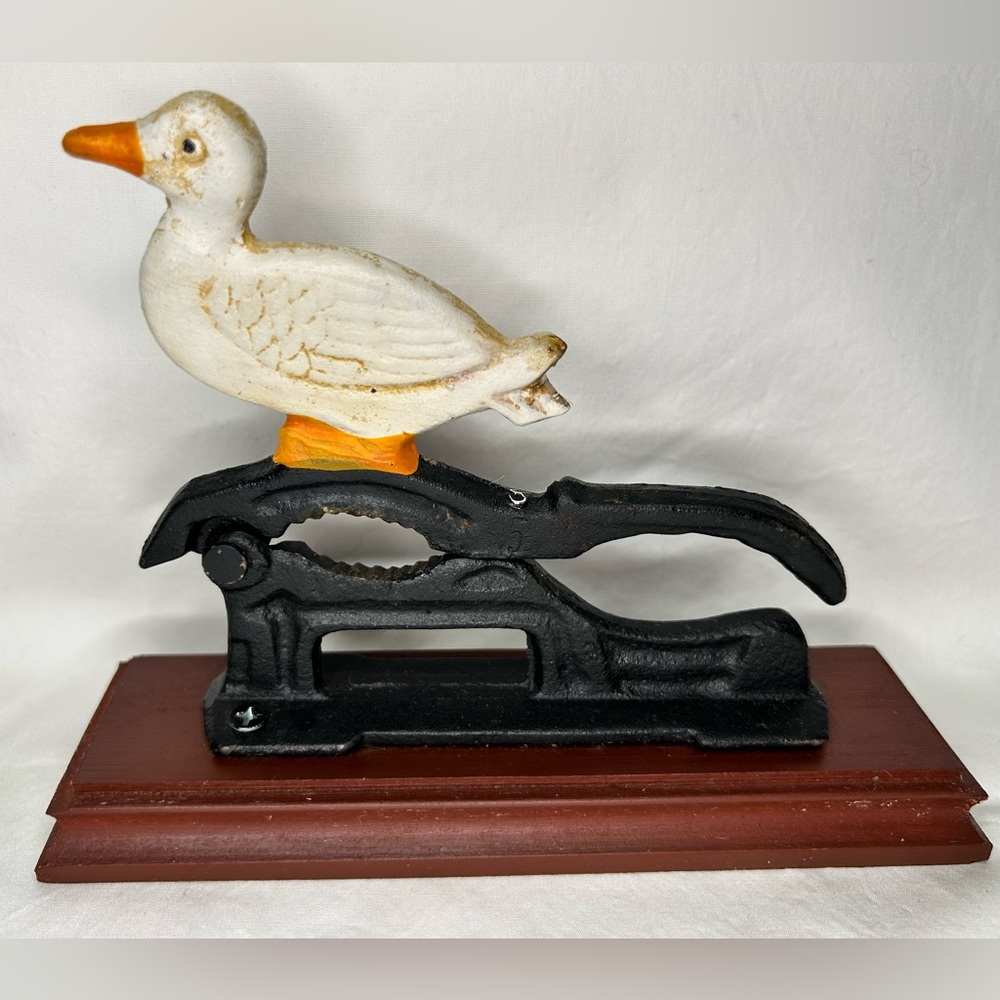Vintage Duck Cast Iron Nutcracker Duck on wood base.
